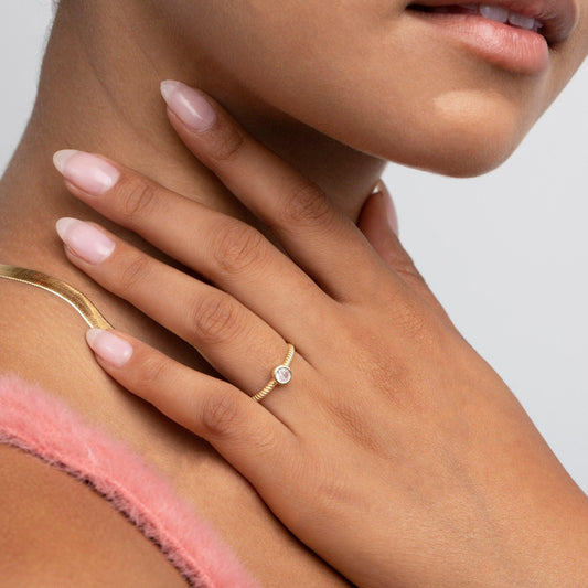 Close detail of the Solitaire Stackable Ring in 18K Gold Vermeil with CZ Diamond. Hypoallergenic, no green marks, premium.