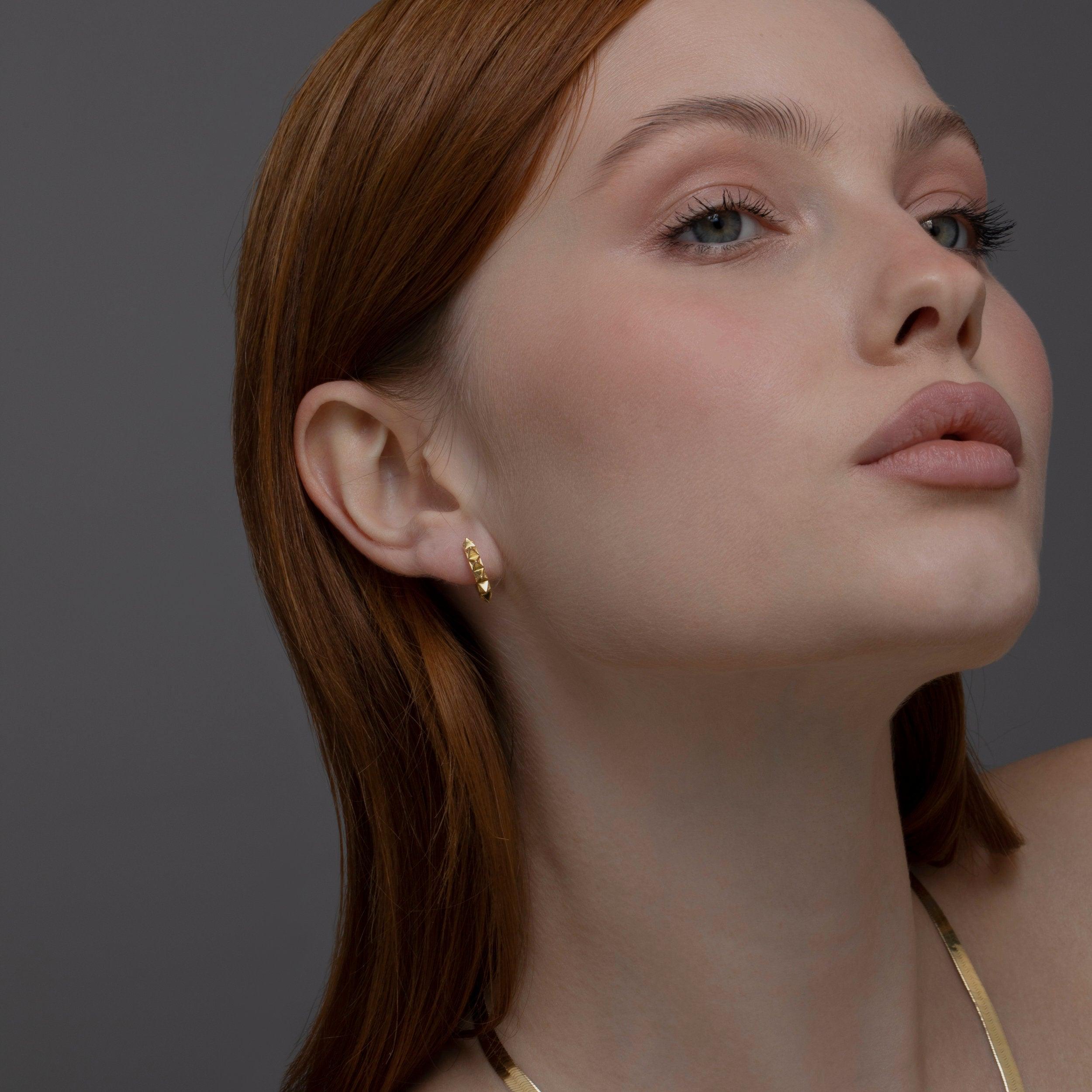 The Spike Huggie Earring worn in 18K Gold Vermeil — refined accessory for women. Tarnish-resistant.