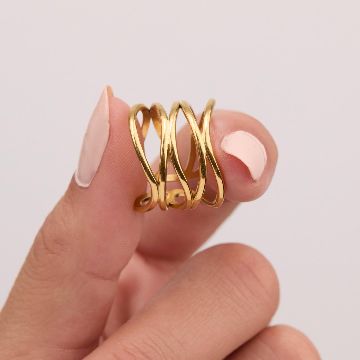 The Stackable Adjustable Fashion Ring worn in Gold-Plated Steel — refined accessory for women. Hypoallergenic, no green.