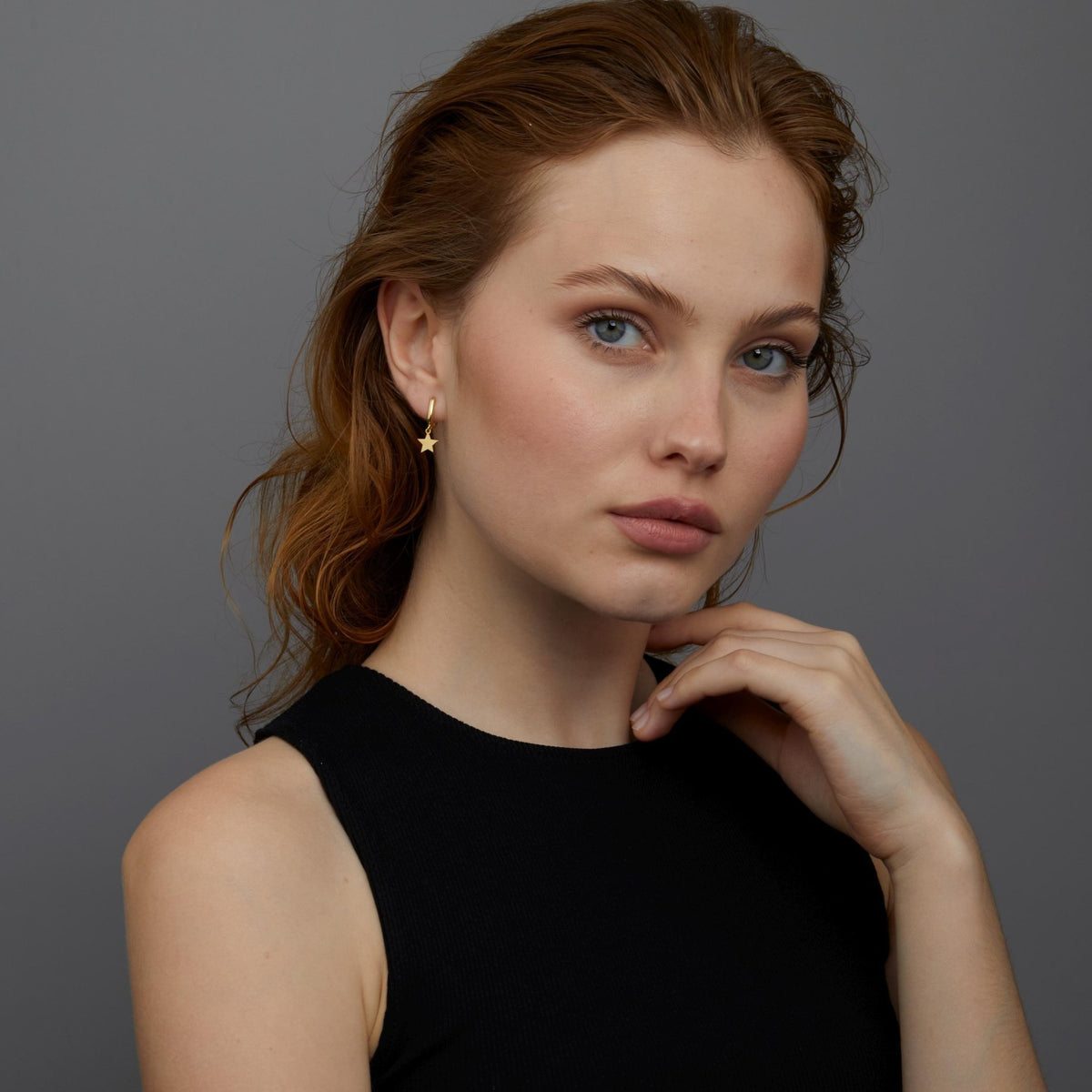 The Star Hoop Earrings styled in 18K Gold Vermeil — elegant everyday jewelry. Hypoallergenic for sensitive ears.