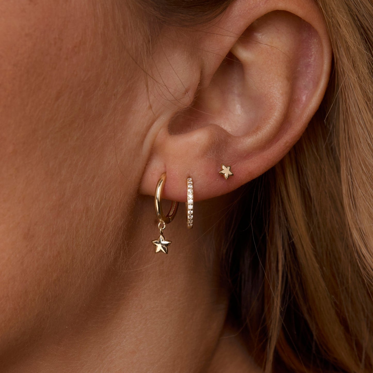 Close detail of the Star Hoops Stud Earring Set in 18K Gold Vermeil. Tarnish-resistant, premium handmade jewelry.