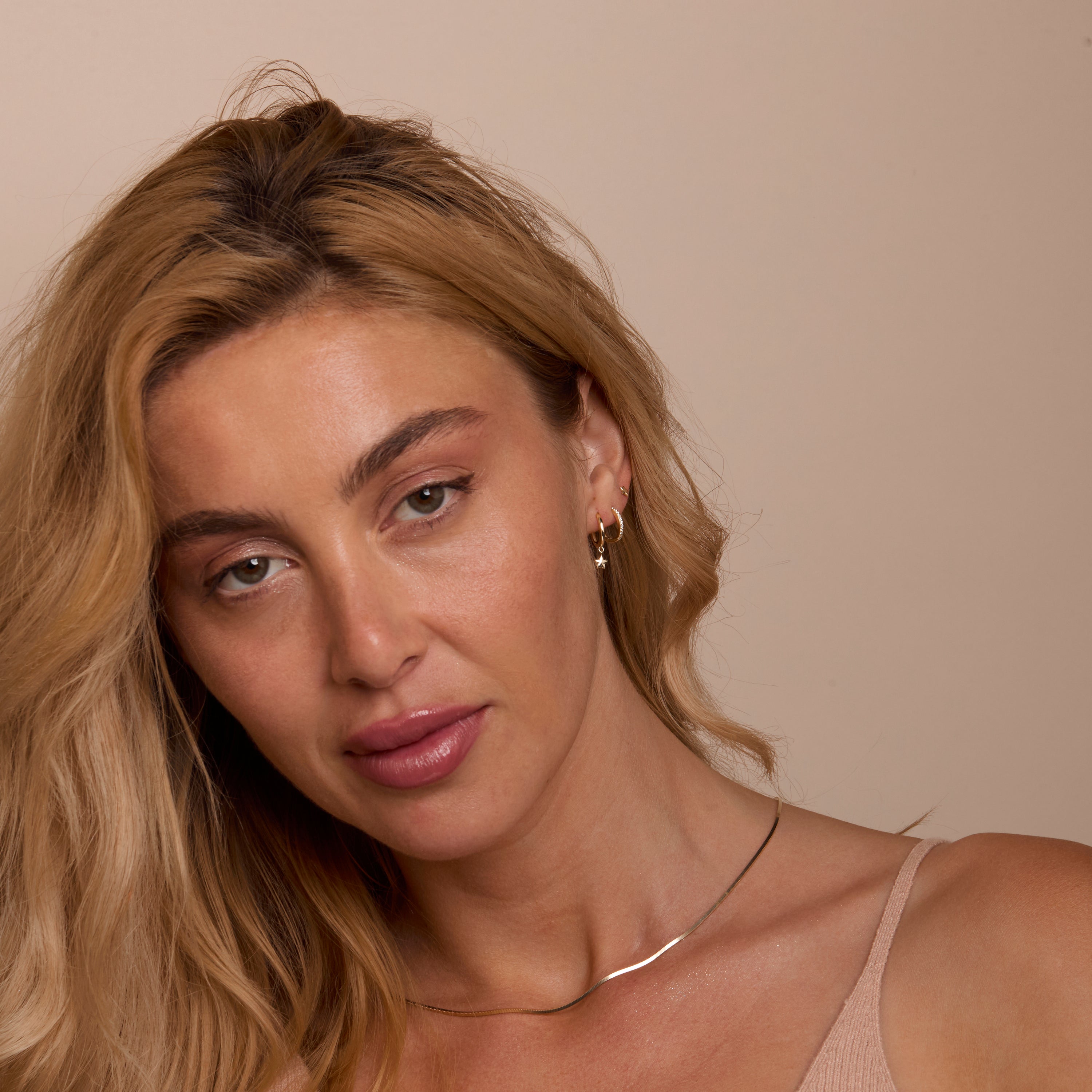 The Star Hoops Stud Earring Set worn in 18K Gold Vermeil — refined accessory for women. Tarnish-resistant.