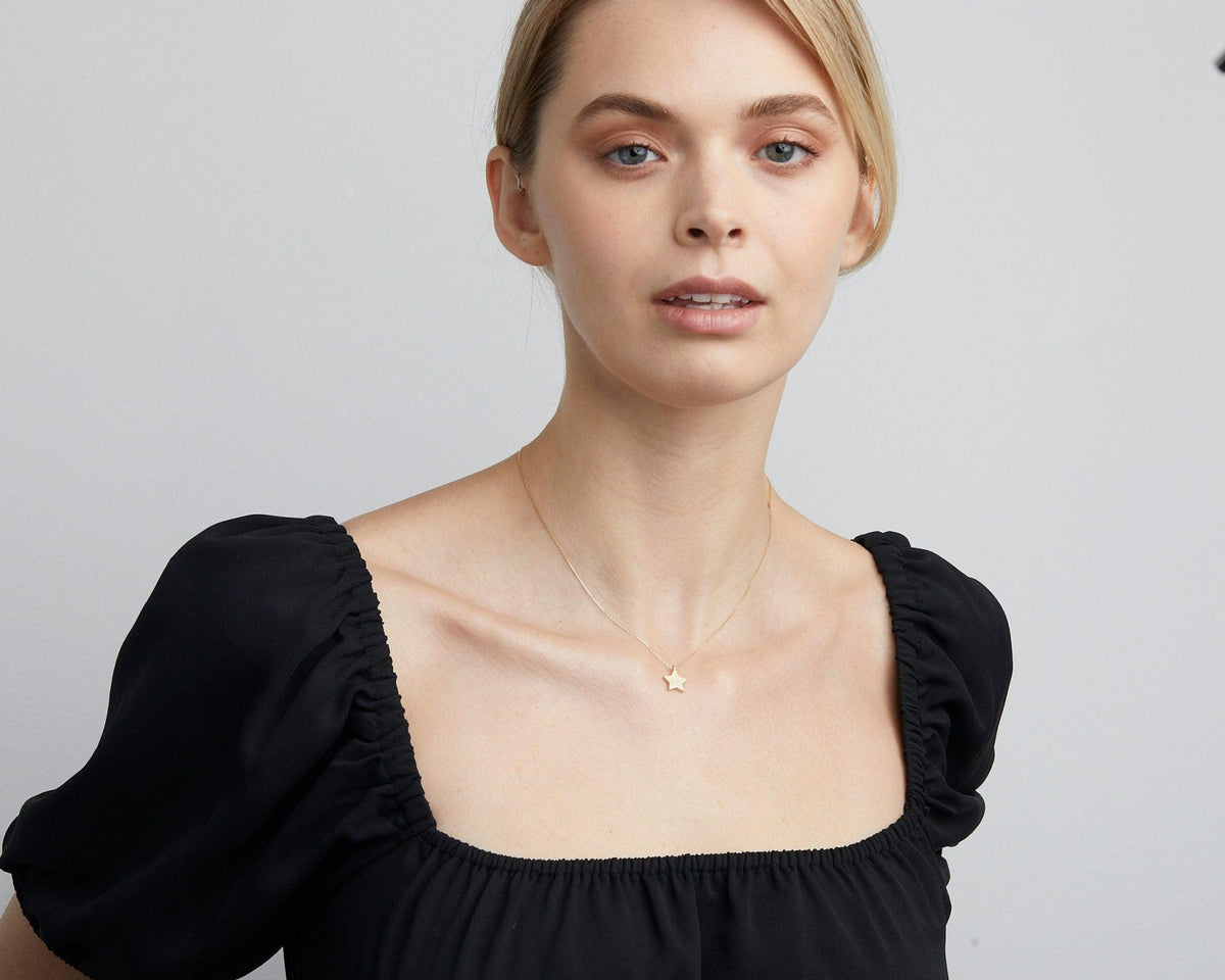The Dainty Star Necklace styled in 18K Gold Vermeil — elegant everyday jewelry. Hypoallergenic, no green marks.