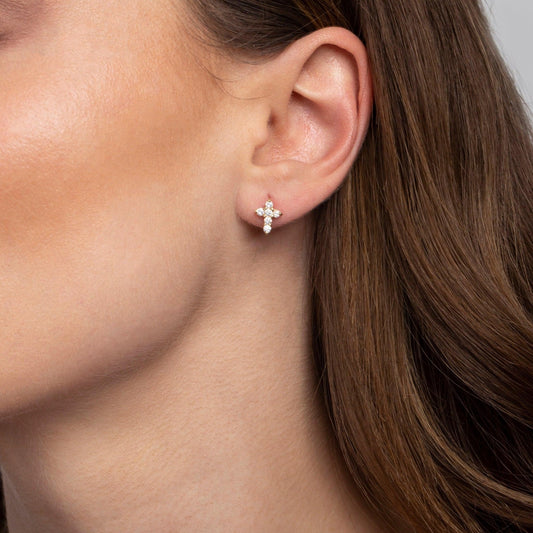 Close detail of the Sterling Silver Diamond Cross Stud Earrings in 18K Gold Vermeil with CZ Diamond. Tarnish-resistant.