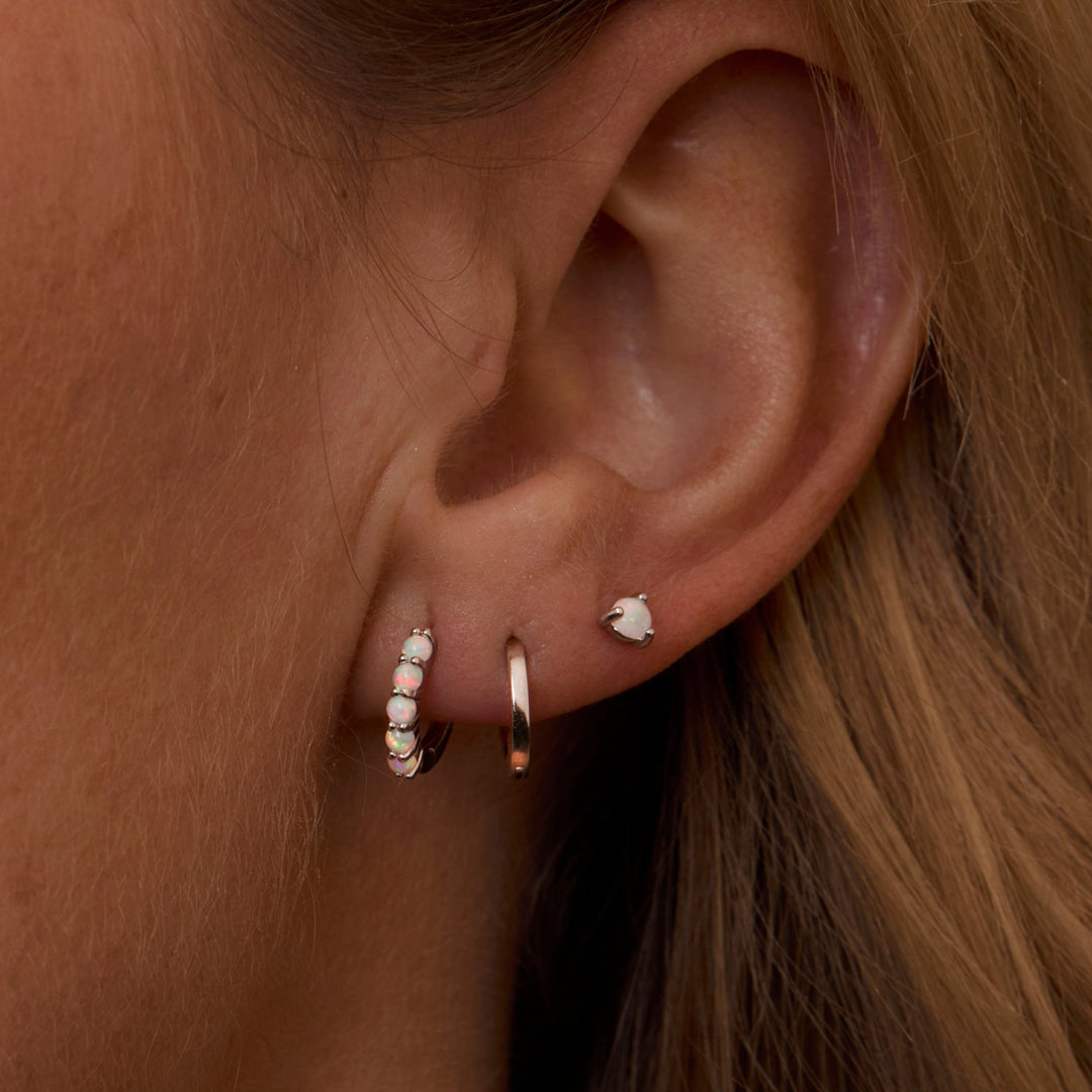 Macro detail of the Sterling Silver Opal Earring Set: Opal set in 18K Gold Vermeil. No green marks, handmade jewelry.