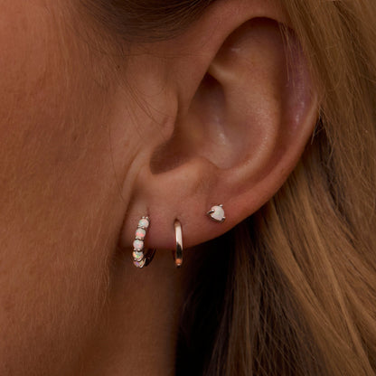 Macro detail of the Sterling Silver Opal Earring Set: Opal set in 18K Gold Vermeil. No green marks, handmade jewelry.