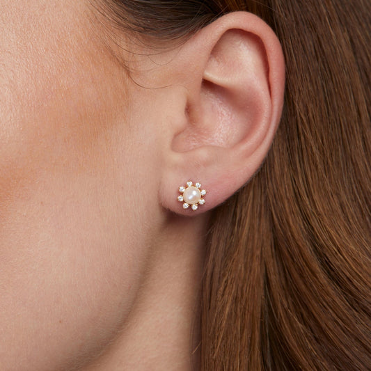 Close detail of the Sun Pearl Stud Earrings in 18K Gold Vermeil with Freshwater Pearl. Tarnish-resistant, premium handmade.