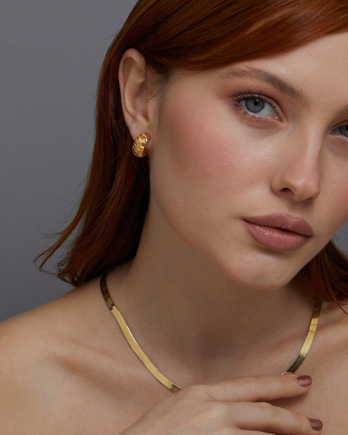 The Textured Hinged Huggie Hoop Earrings as a graduation gift in 18K Gold Vermeil. Tarnish-resistant, made for keeping.