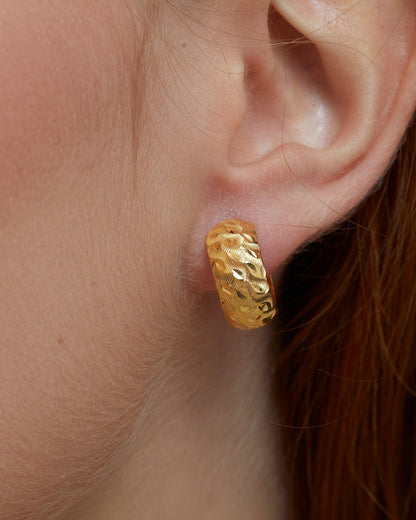 Textured Hinged Huggie Hoop Earrings styled with complementary pieces in 18K Gold Vermeil. Hypoallergenic for sensitive.