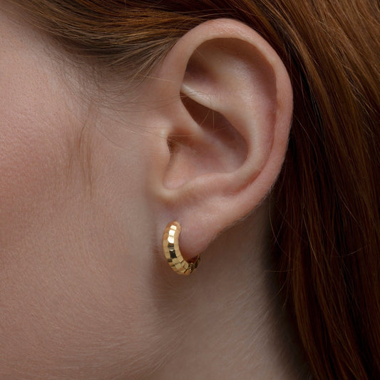 Close detail of the Textured Huggie Hoop Earrings in 18K Gold Vermeil. Tarnish-resistant, premium handmade jewelry.