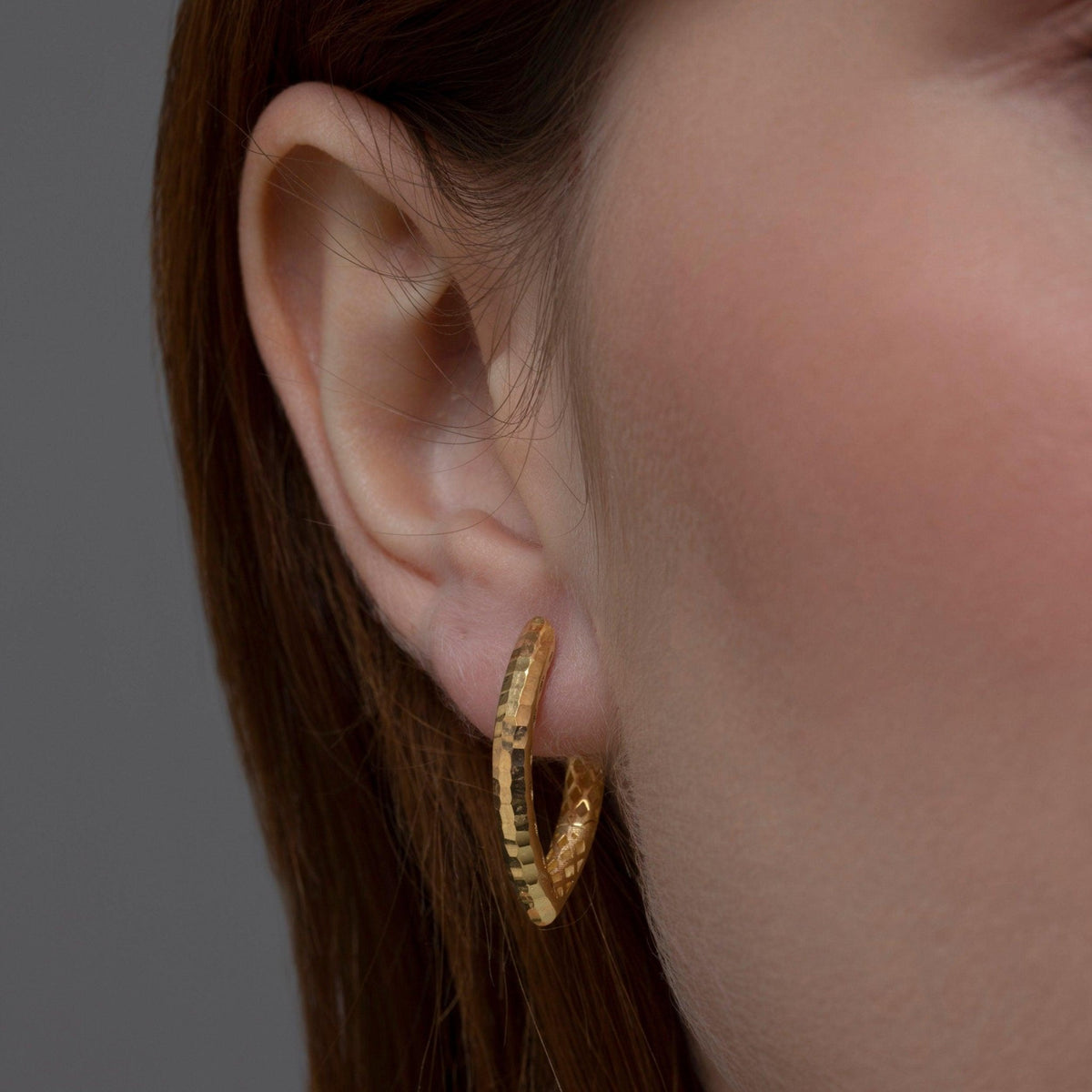 The Textured Statement Hoop Earring styled in 18K Gold Vermeil — elegant everyday jewelry. Hypoallergenic for sensitive ears.