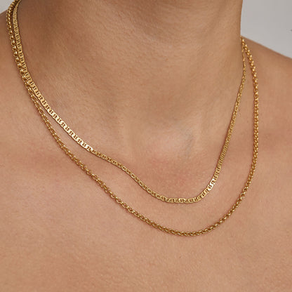 Layered chain necklace look with the gold traversino chain
