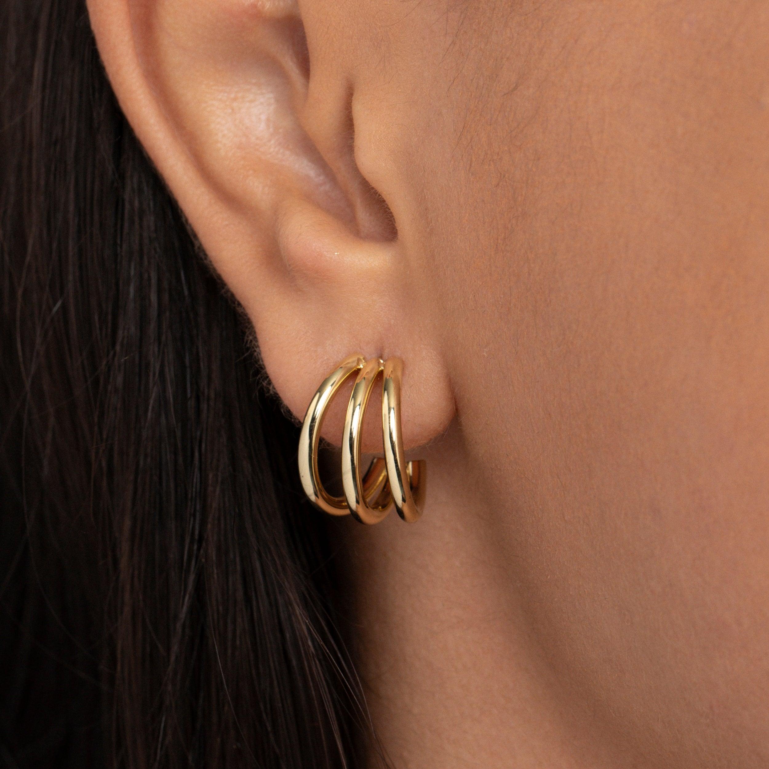 Close detail of the Gold Triple Hoop Earrings in Gold-Plated Steel. Tarnish-resistant, premium handmade jewelry.