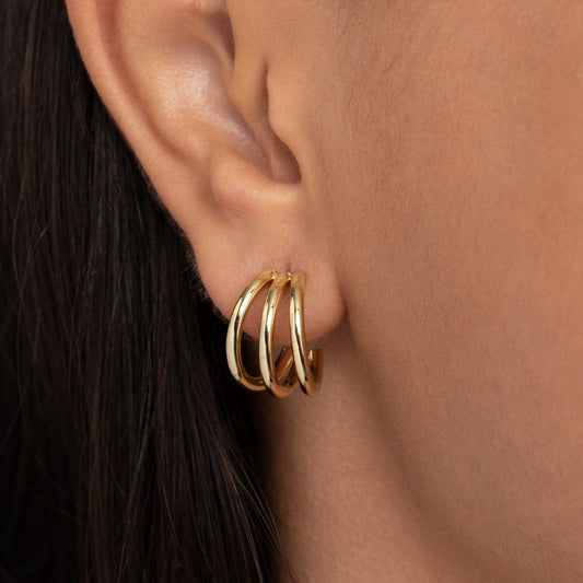 Close detail of the Gold Triple Hoop Earrings in Gold-Plated Steel. Tarnish-resistant, premium handmade jewelry.