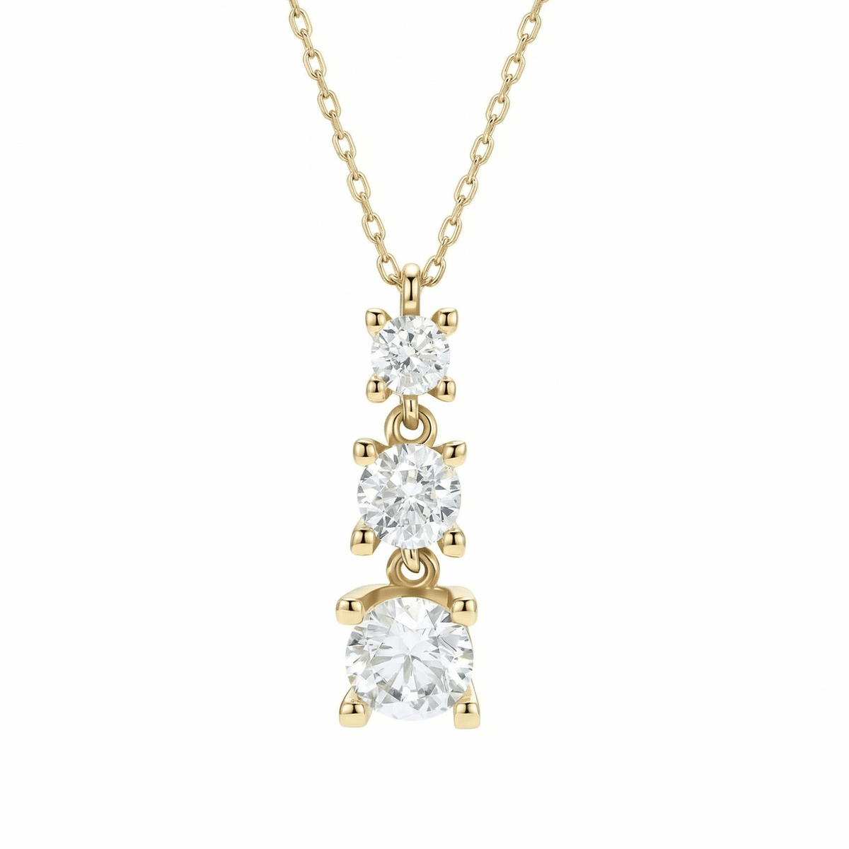 Triple stone necklace in 14K solid gold: three graduated round CZ stones, each in a four-prong setting, on a fine chain against a white background.