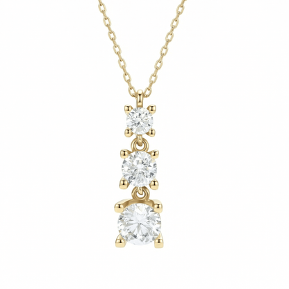 Triple stone necklace in 14K solid gold: three graduated round CZ stones, each in a four-prong setting, on a fine chain against a white background.