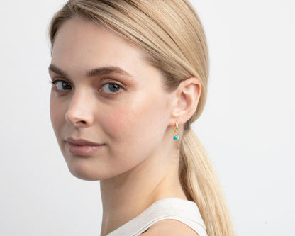 The Turquoise Drop Hoop Earrings styled in 18K Gold Vermeil — elegant everyday jewelry. Hypoallergenic for sensitive ears.
