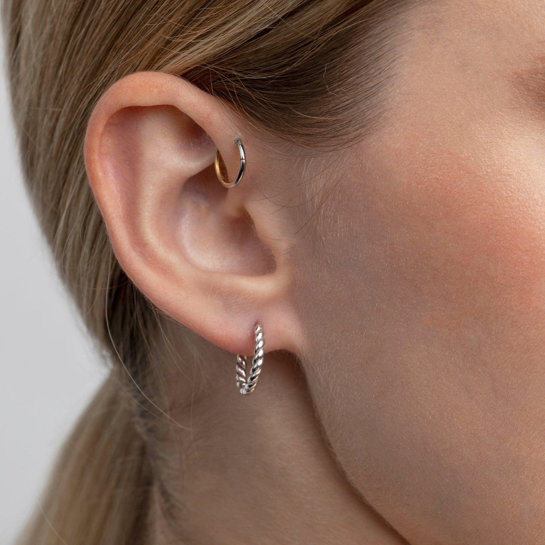 The Twisted Rope Hoop Earrings styled in 18K Gold Vermeil — elegant everyday jewelry. Hypoallergenic for sensitive ears.