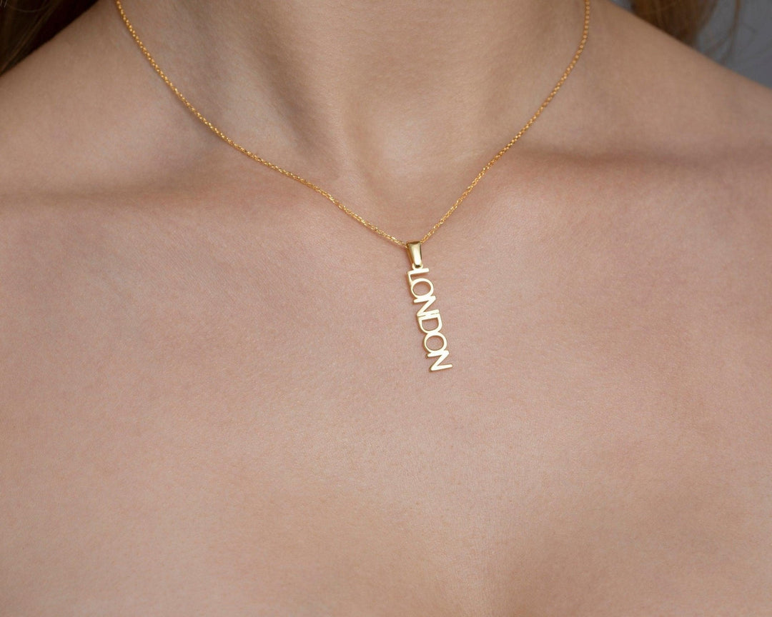 Close detail of the Vertical Name Necklace in 18K Gold Vermeil. Safe for sensitive skin, premium handmade jewelry.