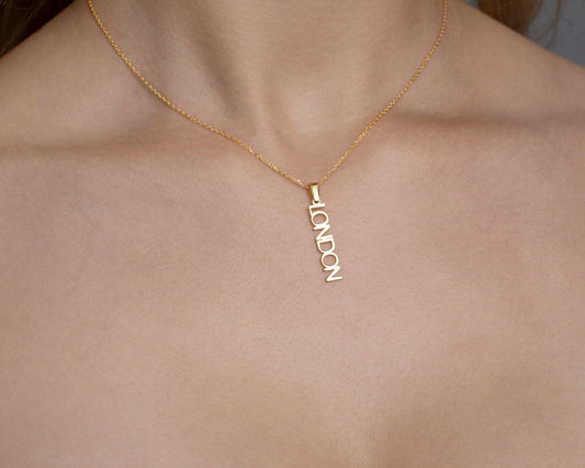 Close detail of the Vertical Name Necklace in 18K Gold Vermeil. Safe for sensitive skin, premium handmade jewelry.