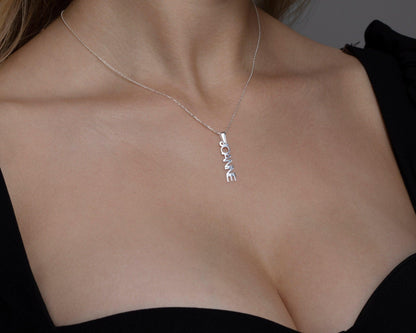 The Vertical Name Necklace as an anniversary gift in 18K Gold Vermeil. Safe for sensitive skin, made for keeping.